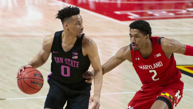 Mar 7, 2021; College Park, Maryland, USA; Penn State Nittany Lions guard Myreon Jones (0) dribbles as Maryland Terrapins guard Aaron Wiggins (2) defends during the first half at Xfinity Center. Mandatory Credit: Tommy Gilligan-USA TODAY Sports